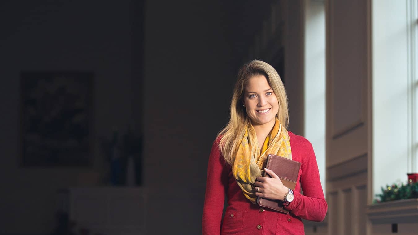 A Regent graduate at the chapel: Pursue Regent's BA in Leadership Studies - Christian Ministry program online or in Virginia Beach.