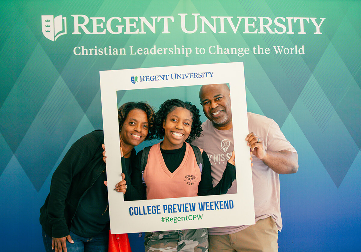 Family smiling together for a picture  at College Preview weekend at Regent University.